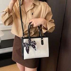 Snake pattern tote bag with heart print scarf decor and adjustable shoulder strap