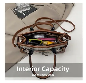 Detailed view of the internal capacity and compartmentalized design of this woven tote bag