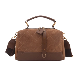 Dark brown suede crossbody bag with diamond quilting and vintage pillow shape