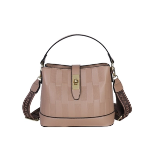 Fashionable dusty pink bucket bag with textured leather and wide woven shoulder strap