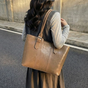 Classic brown oiled leather tote bag for women with spacious interior for daily commuting