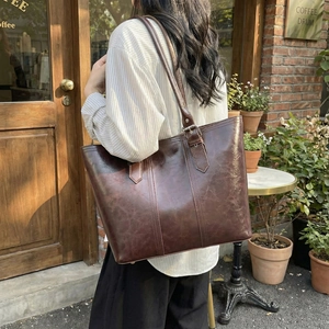 Large dark brown oil wax leather tote bag with adjustable strap for commuting