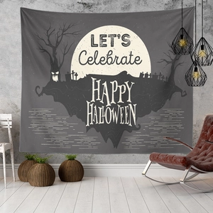 Detail of Halloween tapestry with moon and gravestones in a modern room setting