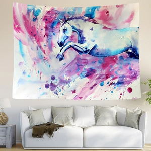 Colorful watercolor white horse tapestry wall hanging over a white sofa in a living room