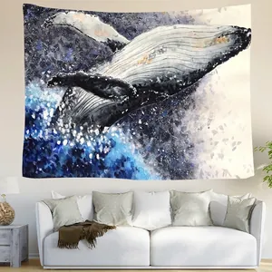 Artistic watercolor whale tapestry hanging above a modern sofa in a living room decor
