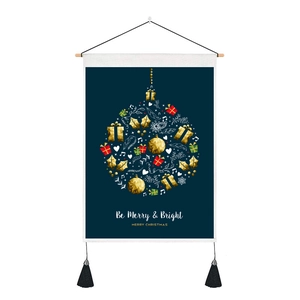 Christmas wall hanging with festive wreath design and tassels on dark blue background