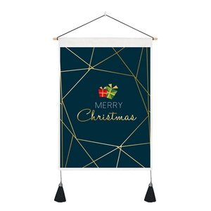 Detail of canvas Christmas tapestry with gold lines, wooden rod, and black tassels