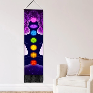 Vertical wall tapestry with meditation silhouette and seven colored chakra symbols and tassels