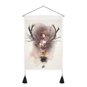 Detail of artistic elk deer wall tapestry with wooden hanging rod and black tassels