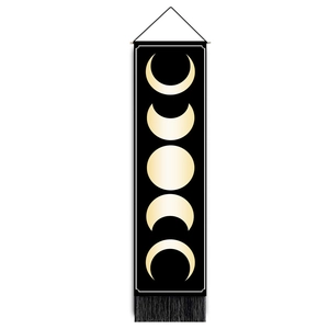 Detail of moon phase wall tapestry with black background, gold prints and black tassels