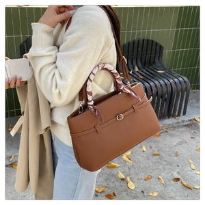 Brown lychee texture tote bag with vintage silk scarf and decorative belt buckle detail
