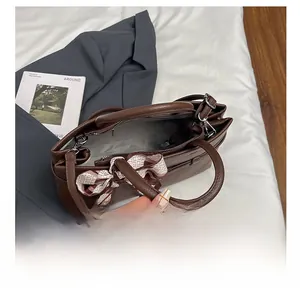 Interior view of brown lychee texture tote bag showing spacious lining and zipper pocket
