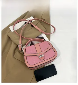 Pink striped crossbody bag capacity display showing internal space with a smartphone