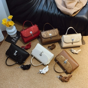 Retro multi-color leather messenger bags with metallic lock and key charm detail