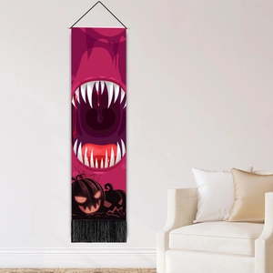 Halloween monster mouth wall scroll with pink print and tassels in a living room