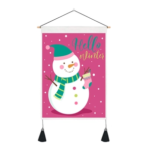 Detailed view of Hello Winter snowman wall tapestry with wooden rod and black tassels