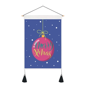 Detail of Christmas wall hanging featuring Merry Xmas pink bauble and black tassels