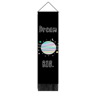 Vertical wall tapestry with colorful planet print, black fringe, and Dream Big slogan