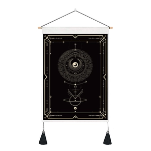 Black and gold tarot tapestry with geometric occult patterns, wooden pole, and tassels