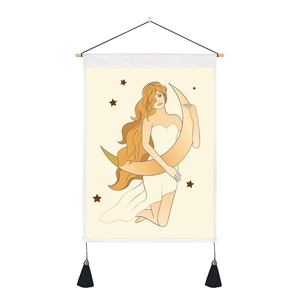 Artistic wall tapestry featuring a woman embracing a golden moon with tassel accents
