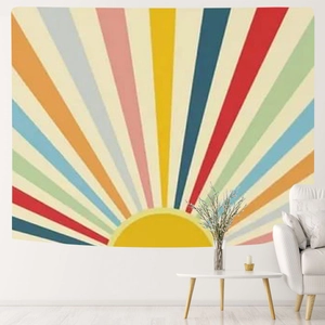 Detail of bohemian rainbow sunrise tapestry showing vibrant colorful sun rays on a wall