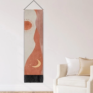 Bohemian canvas wall hanging with abstract sun and moon patterns and black tassels