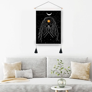 Bohemian moon eclipse tapestry with goddess line art, tassels, and wooden hanger for home decor