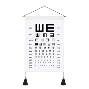 Visual eye chart tapestry on white canvas with wooden hanger and black tassels