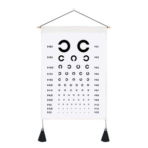 Detail of Landolt C eye chart tapestry with wooden hanger and black decorative tassels
