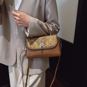 Classic brown and gold contrast flap handbag with metal lock and detachable shoulder strap