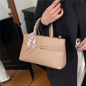 Beige lychee pattern leather tote bag with silk scarf and decorative strap on metal buckle