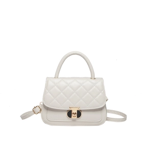Elegant cream quilted crossbody bag with top handle and gold clasp on white background