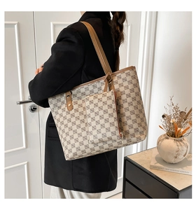 Large vintage print tote bag with matching pouch shown on shoulder in a lifestyle setting