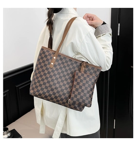 Detailed side view of a brown checkered tote bag set with matching small zipper pouch