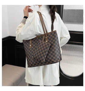 Detail of printed large capacity tote bag and matching small pouch with geometric pattern