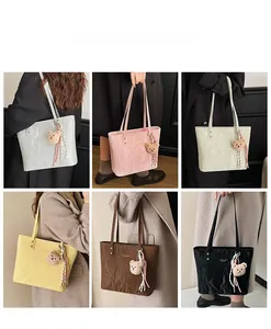 Detailed grid of oversized tote bags in six colors featuring plush bear charms and rivets