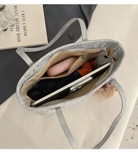 Internal view of the large gray crocodile pattern tote bag showing spacious compartments