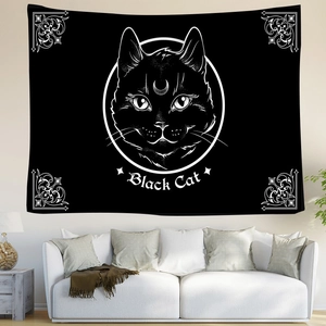 Detail of bohemian black cat tapestry with crescent moon symbol on a white wall