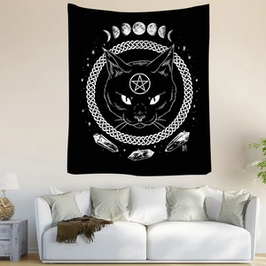Detailed view of bohemian black tapestry with cat head, pentagram, and moon phases