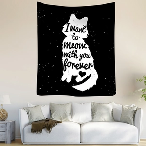 Detail of bohemian black and white cat tapestry with meow quote for wall decoration