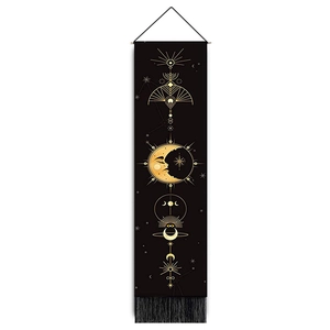 Bohemian black and gold solar eclipse wall tapestry with celestial patterns and fringe