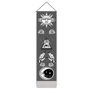 Detailed view of sun and moon wall tapestry with celestial motifs and wood hanging rod