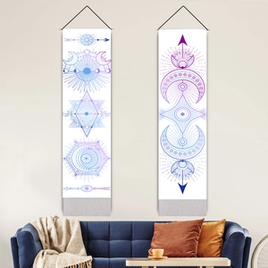 Bohemian tapestry set with moon phase and geometric stars over a modern blue sofa