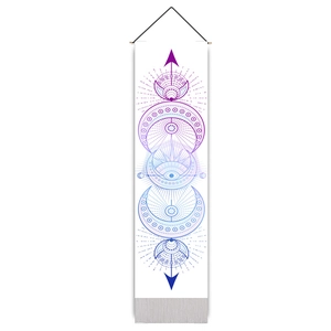 Detail of bohemian rectangle tapestry with moon phases and mystical all-seeing eye design