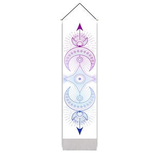 Vertical bohemian wall hanging featuring purple mystical celestial moon and star patterns