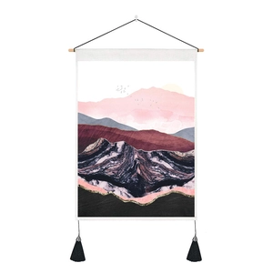Detail of Nordic abstract mountain tapestry with golden sun, wooden rod, and black tassels