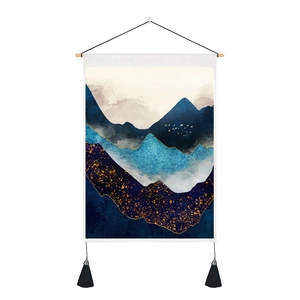 Detail of Nordic blue mountain tapestry with gold texture and wooden hanging rod