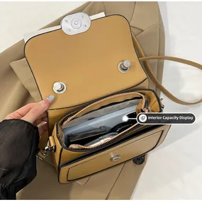 Detailed top view showing the interior capacity of a khaki saddle bag with essentials