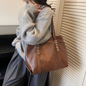 Brown vintage large capacity tote bag in soft leather with white stitching detail