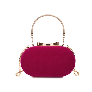 Retro velvet evening clutch bag with gold handle and chain in vibrant fuchsia